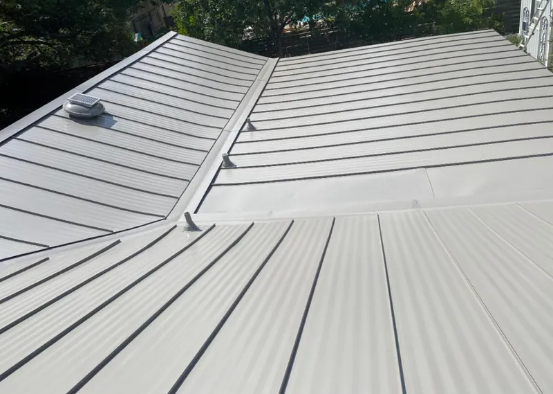 Solar attic fan installed on a metal roof for Roof Ventilation in La Habra Heights